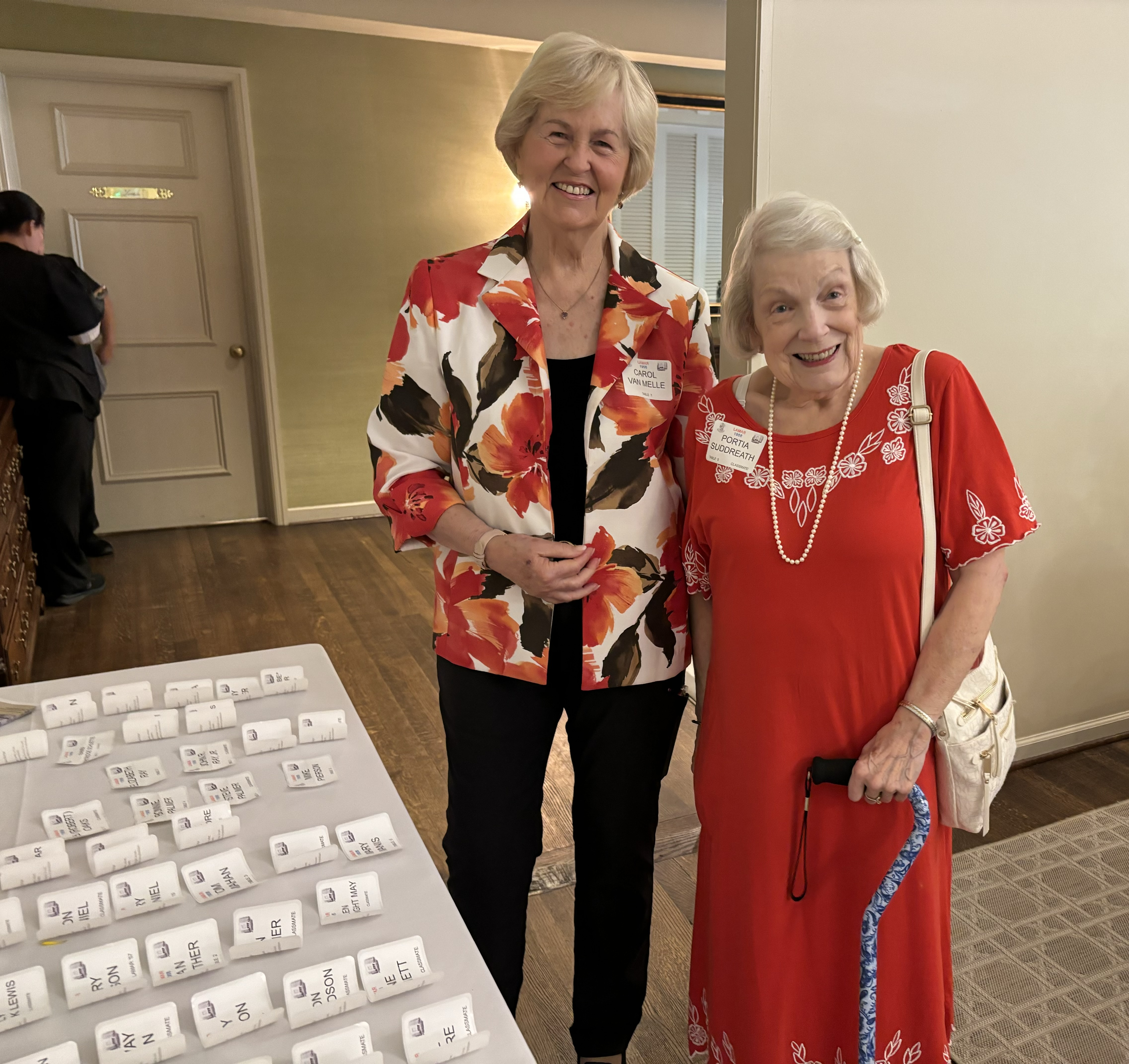 Carol Van Melle, wife of Van, greets Portia Suddreath Sweet.